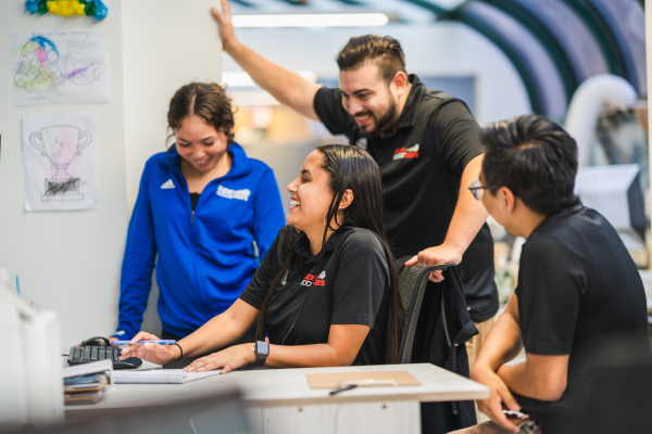 Soccer Stars Leadership Team Working at a Computer